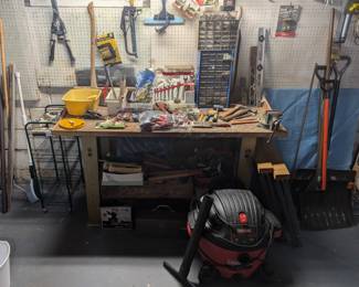 tool bench of hardware and tools, shop vac