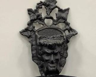 Cast iron match holder with face