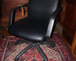 Set of black office swivel chairs around a contemporary conference table (not pictured), Den