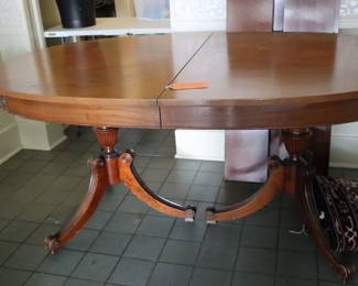 Vintage mahogany, Hepplewhite double pedestal table, has 2 leaves behind it, in side entrance room