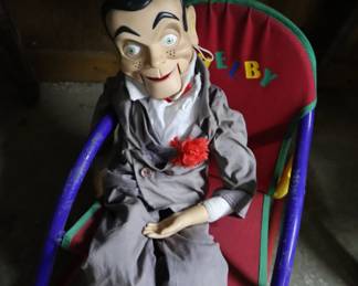 Puppet in a child's chair; Garage