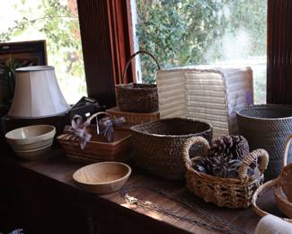 Bowls and baskets in the window seat of the den