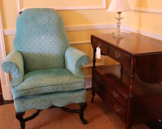 Teal velvet, high back chair beside a server in LR