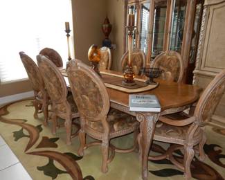 Bernhardt dining table with eight chairs and matching custom carpet