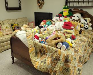 Antique Bed. Vintage and newer plushies