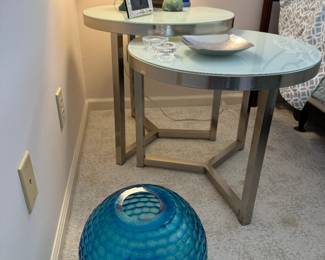 Unique "nesting" tables? But not quite because the smaller doesn't completely slide under, but they kind of come together like an eclipse. Or use them separately! Homeowner had them used separately, but I put them together for picture.