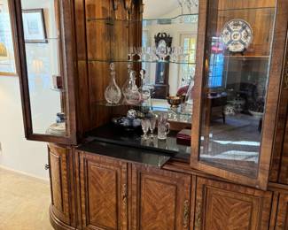 Pull-out dry bar, and so much storage! Center piece is 73" long, each corner cabinet adds 19.5" to total length (112" x 20" deep). Breaks down to several pieces.