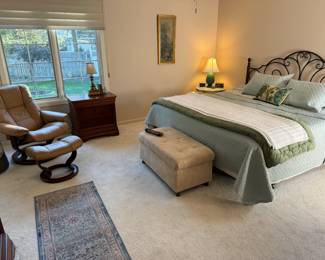 Pretty primary bedroom. Stressless recliner, king size bed