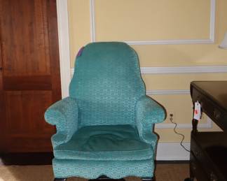 Extremely comfortable, erect back lounge chair. You must sit in it. It is perfect for anyone who has back issues or trouble getting out of a lower chair.  In the LR. 