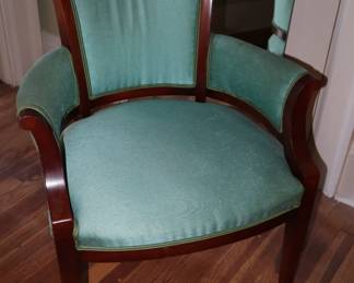 A comfortable, curved back, mahogany and teal upholstery chair. It is time for new upholstery but the remainder is wonderful. Upstairs in the master bedroom.