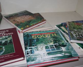 Laying in a tall storage piece in the upstairs northeast bedroom, books about landscaping. Marcie Scriber has worked tirelessly over forty years to turn this land into a showplace. 