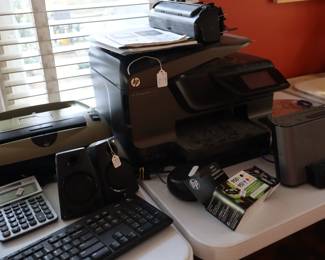 Variety of office equipment and supplies in the porch sunroom, south side of the house. A complete computer is on the 2nd floor landing.