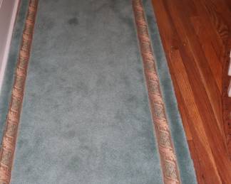 Custom made teal, carpet runner with a tapestry flat braid inset. On the landing, upstairs.