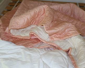 A small number of high end bedding pieces upstairs in northeast bedroom.