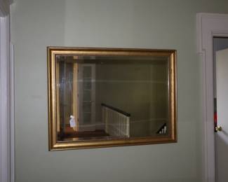 Framed mirror in gilt frame. Upstairs on landing.