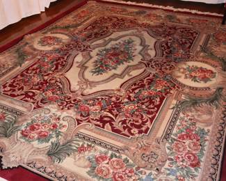 Complete view of the hand knotted, rug made of wool and silk, laying in the DR. 