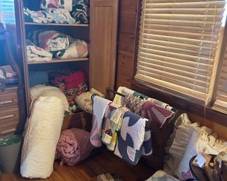 Armoire and beautiful handcrafted quilts and afghans