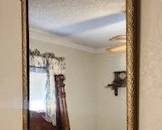 Old gold mirror with floral corners vintage