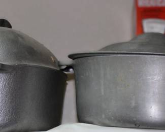 Old hammered cast aluminum oval dutch ovens