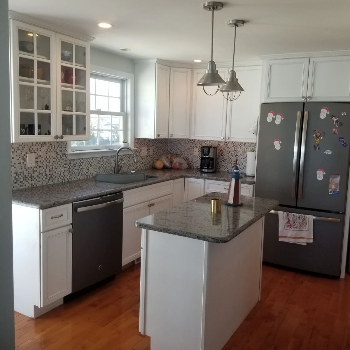 White kitchen cabinets with granite countertops