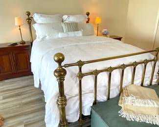 smoked brass queen size bed and Irish linen bedding, french sidetables and dresser, cedar blanket chest