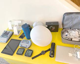 lots of tech! portable speakers, chargers, label makers, MacBook, AirPods, iPad, new dash camera