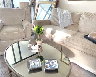 crate and barrel covered sofa and arm chairs, smoked brass mirror table tops, lladro figurines