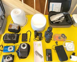 lots of tech! canon cameras, binoculars, new nocci drone, chargers, HP printer