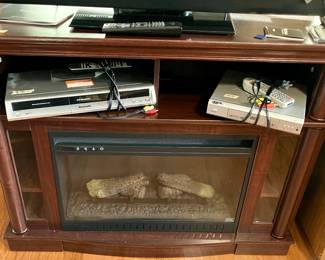 Electric fireplace with room for components.