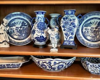 Lots of blue and white decor, vases, plates and bowls.