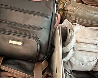 lots of purses, handbags and clutches.