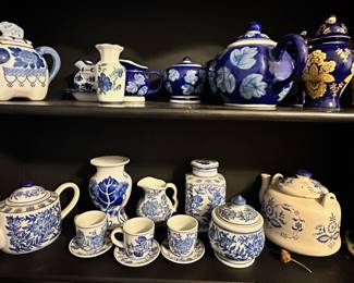 Lots of blue and white decor, vases, plates and bowls.