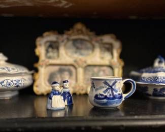 Lots of blue and white decor, vases, plates and bowls.