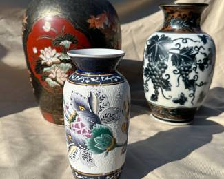 Jars and vases:   large lidded lotus flower vase (left), textured Moriage vase (center) and porcelain grapevine vase (left).