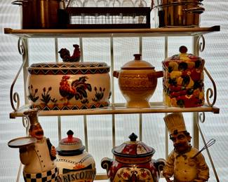 Baker's rack filled with ceramic and porcelain jars and other decorative statues.