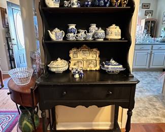 Lots of blue and white decor, vases, plates and bowls.