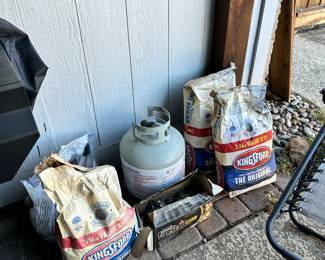 Charcoal and propane tank