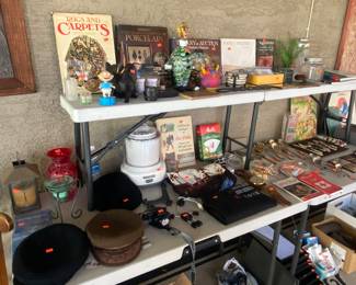 Books, old hats, candles, misc stuff, oh, and a Murano Glass Clown of my parents, hand broke off but it is still there by the guy