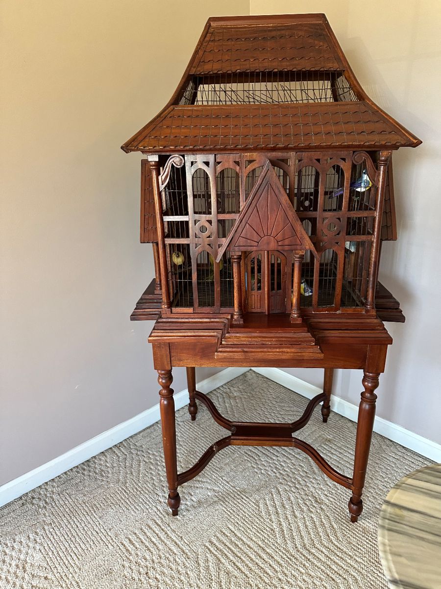 Vintage wooden birdcage on stand
