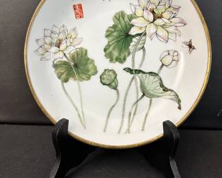 Lotus with a brass base 