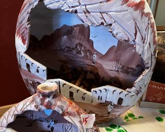 Utah Indian pottery with scenery within the pottery. 