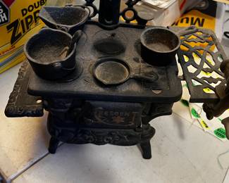 Small antique stove and cooking utentils. Iron