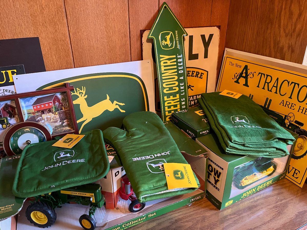 Large collection of John Deere collectibles, toys, books, tools and more.
