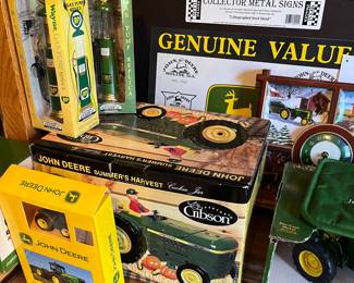 Large collection of John Deere collectibles, toys, books, tools and more.