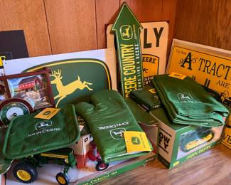Large collection of John Deere collectibles, toys, books, tools and more.