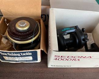 Shakespeare No. 1827 Tru-Art Automatic reel (left in photo); Mitchell Riptide 50LW reel.