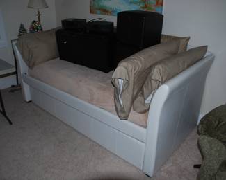 Interesting sofa/bed with a trundle bed underneath- 