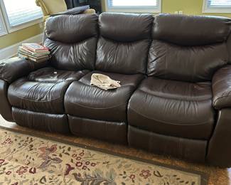 This leather couch has two recliners one on each end and it powered just plug it in and relax 