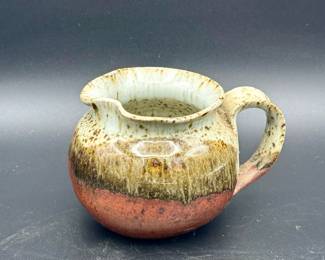 Signed Ceramic Creamer Pitcher
https://ctbids.com/estate-sale/31612/item/3566211/Signed-Ceramic-Creamer-Pitcher