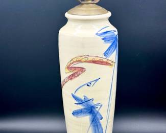 https://ctbids.com/estate-sale/31612/item/3566223/Signed-Pottery-Lamp